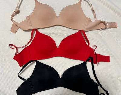Assortment of different colored used bras